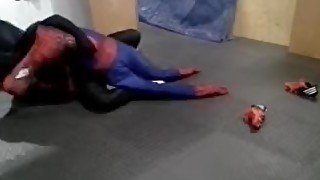 black sex drone playing with his spiderman dummy