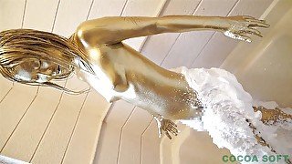 Start painting gold paint on the whole body using a brush