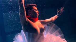 Bulava Lozhkova with a red tie and skirt underwater