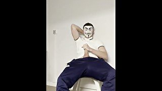 Twink wearing anonymous mask wanks on camera