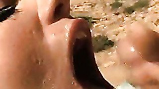 Kelly Divine recieves a warm jizz on her mouth outdoor