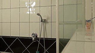 Amazing brunette lets her man record her shower