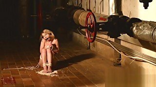 Kate in the cellar tiptoeing and kneeling on beans