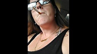 Nerdy Milf Smoking Cigarettes In Truck