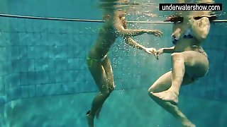 Two sexy amateurs showing their bodies off under water