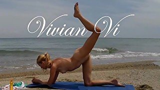 Nude Yoga Workout of a beautiful blond woman with nice tits and perfect pussy on the Beach