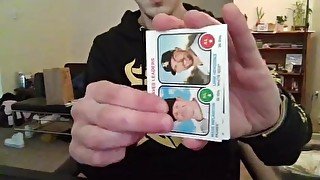 Cute Nerd Opening a Pack of Trading Cards