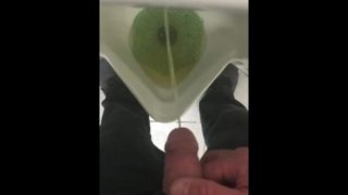 Pissing in a urinal in public at work