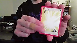 Cute Nerd Opening a Pack of Cards