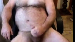 Hairy daddy bear stoking his cock