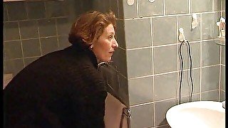 Woman pissing in the bathroom