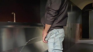 Man pisses in the toilet and plays with his piss