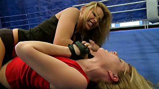 Two arousing whores fight inside the boxing ring being fully naked