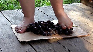 MILF tramples grapes with her bare feet.