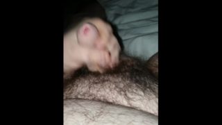 Hairy young guy jerks off in room at night