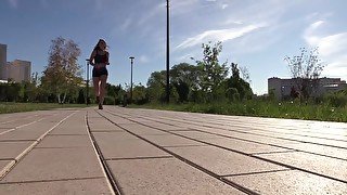 SFW. A girl in a sexy suit is engaged in fitness. Running and squats