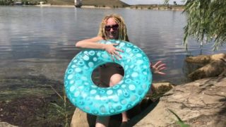 Inflating a swimming ring on the lake