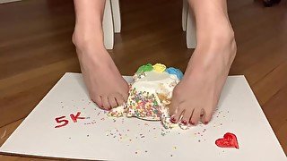 Crushing cake with feet