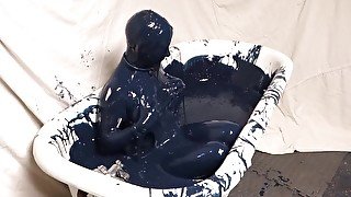 Girl bathes in black slime and masturbates