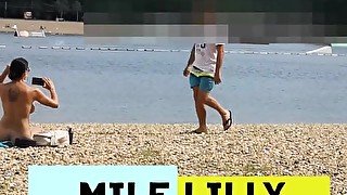 Milf Lilly naked on public beach got oil massage from stranger