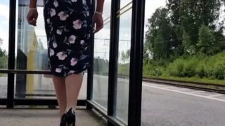 HannaTransa Chastity Crossdresser outdoors at train station.