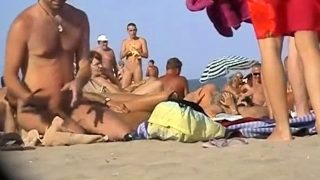 Voyeur Guy wanking and fuck redhead girl on a public beach