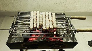 Daddy grills pork souvlaki and gets juicy meat