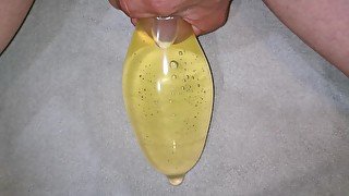 Filling condom with piss