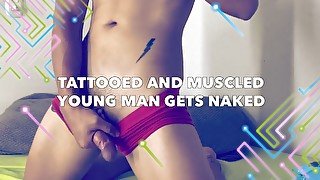 Tattooed and muscled young man gets naked