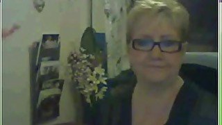 Hot blonde milf with big tits teasing on the webcam