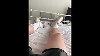 Uncut teen plays with his hairy cock in rubber and sneakers