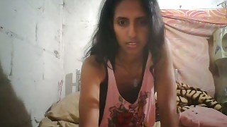 Slim exotic slut masturbates in front of a web camera