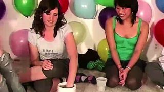 Amateur group strip while playing a party game