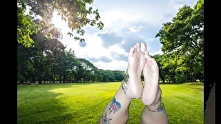 Sexy Feet in the Pose at the Park