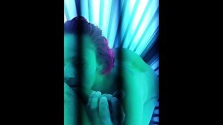 Blowjob in tanning booth