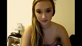 Blonde teenage sweetie talks on cam and takes all her clothes off