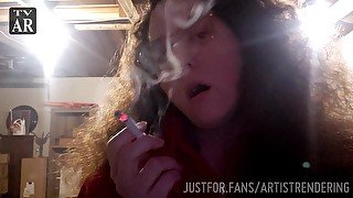 Curly haired brunette lovingly blows smoke in your face