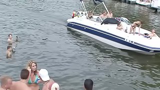 Party time on the lake has lots of topless amateur cuties