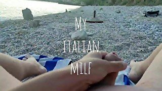 My Wife massages my cock in a public beach