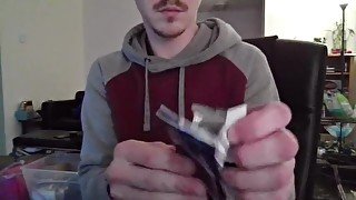 Cute Nerd Opening a Pack of Cards