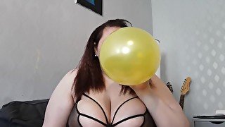 Blowing up some balloons then stomping on them