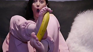 Peeling a banana with her feet