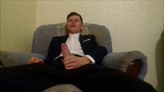 After working in the office, the guy jerks off his cock and ends up in an office suit