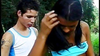 Horny gay sucks young Brazilian shemale Luciana's dong and licks her ass before polishing her chocolate eye outdoors