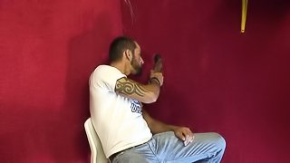 Gay guy visits a gloryhole so he can suck some cock