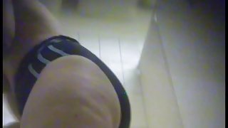 Mature female shows trim on nub on dressing room spy cam