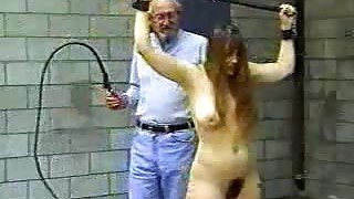 Old man whips a girl in bondage