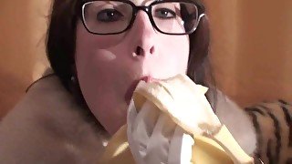 Spex brunette talking dirty while eating banana by Femdom Austria