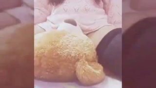 Girl playing with her teddy bear 7u7