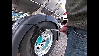 Pissing against a truck tire